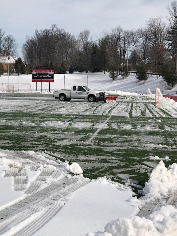 SPS clearing snow from area athletic turf fields and rubberized tracks.